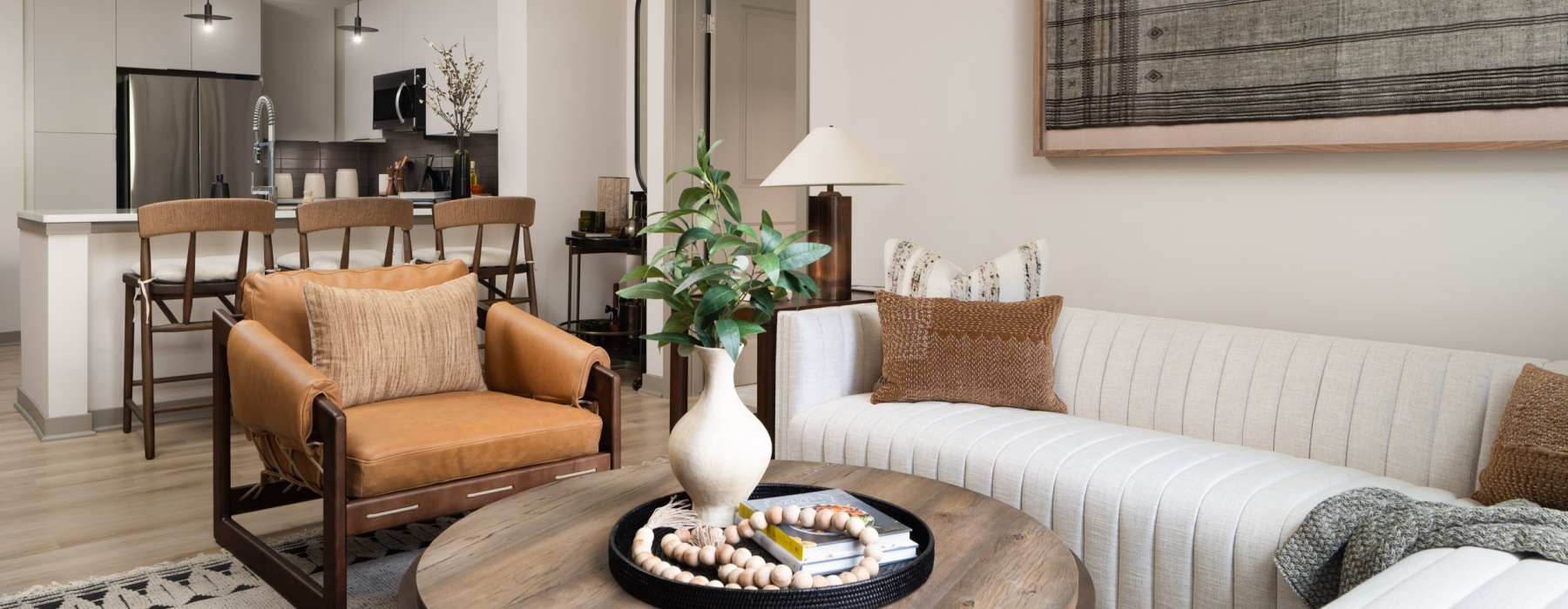 a living room with a rug and a table