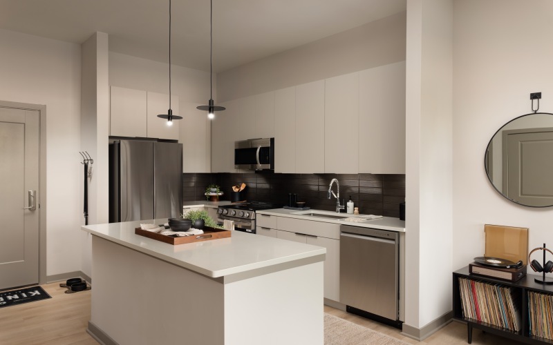 a kitchen with white countertops