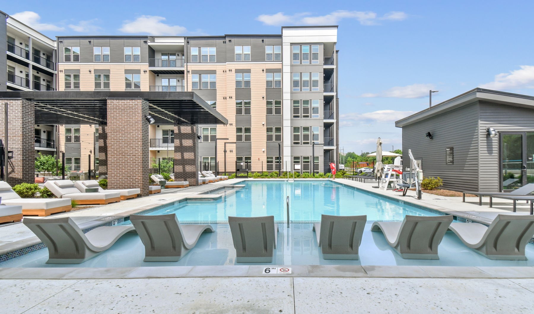 a building with a pool in front