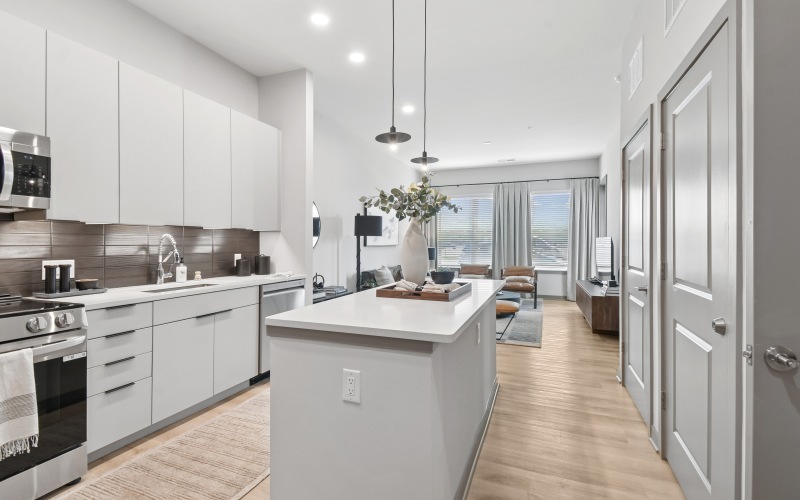 a kitchen with white cabinets