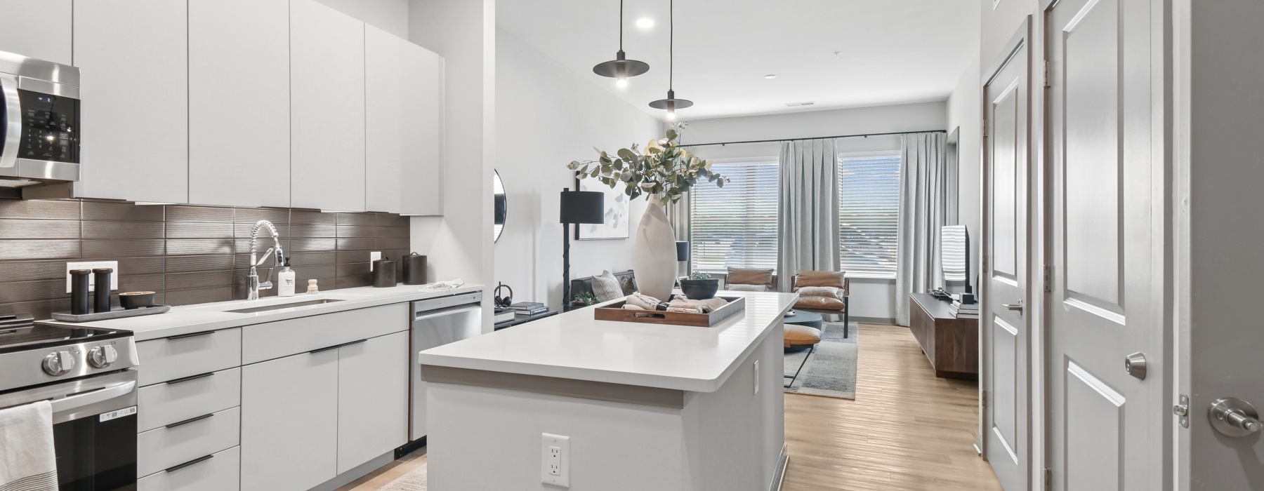 a kitchen with white cabinets